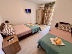Postel nebo postele na pokoji v ubytování Guesthouse Civovic