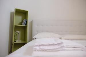 Letto o letti in una camera di Via Gattini Suite