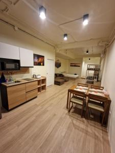 a large room with a table and a kitchen at Bonanza Patong Beach1 100m to Beach Star Room in Patong Beach