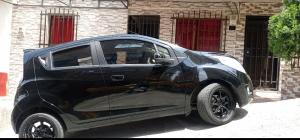 a black car parked in front of a building at Apartamento en el cerro la Asomadera in Medellín