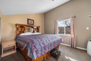 a bedroom with a bed and a window at Shady Gator House Sleep 20 Bachelor and Bachelorette Parties Welcome in Lake Ozark