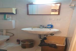 een badkamer met een wastafel en een toilet bij Room in Studio - Independent room for 2 people in Patra