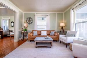 a living room with a couch and a table at Stylish Victorian in Historic District in Cambridge