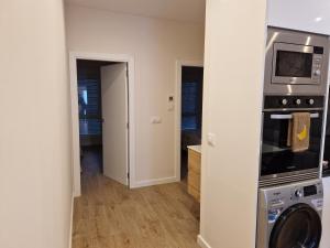 Η κουζίνα ή μικρή κουζίνα στο Apartaments Mariña B5 +4 φωτογραφίες