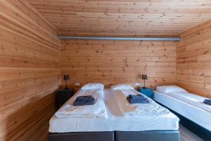 Katil atau katil-katil dalam bilik di Gladheimar Guesthouse