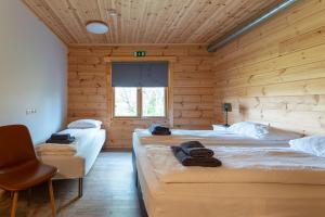 Katil atau katil-katil dalam bilik di Gladheimar Guesthouse