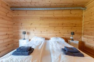 Katil atau katil-katil dalam bilik di Gladheimar Guesthouse