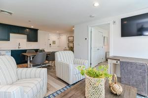 a living room with two couches and a kitchen at Harbourtown Suites, Unit 216 in Plymouth