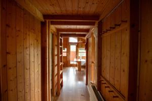 a hallway in a house with wooden walls at Gladheimar Cottages in Blönduós