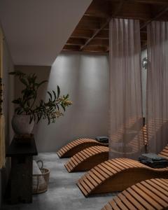 a room with two beds and a vase on the wall at Nima Local House Hotel & Spa in Mexico City