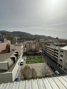 a view of a city with buildings and a parking lot at Urban Haven Sarajevo in Sarajevo