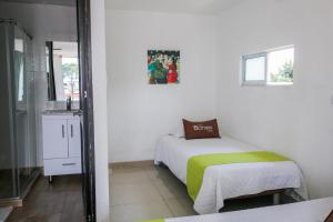 Postel nebo postele na pokoji v ubytování Hotel Casa Botero 303