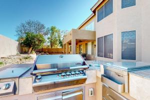 a kitchen with a grill on top of a house at Desert Dreamland Villa in Peoria