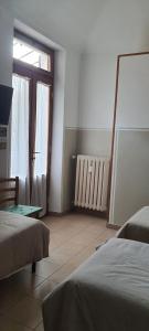 Ένα ή περισσότερα κρεβάτια σε δωμάτιο στο Albergo Avalon