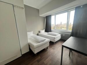 Postel nebo postele na pokoji v ubytování Ootel.com