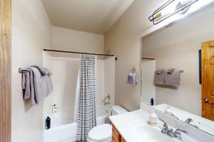 a bathroom with a sink and a toilet and a shower at Ridgetop Retreat - Unit A9 in Show Low +11 photos