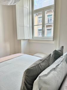 Postel nebo postele na pokoji v ubytování Quarto privativo com banheiro exclusivo fora do quarto
