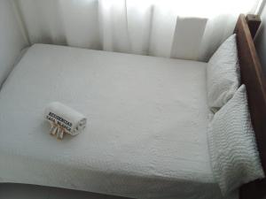 Tempat tidur dalam kamar di RESIDENCIAS CASA BLANCA