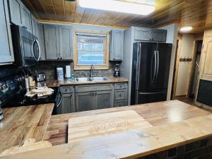 a kitchen with a wooden counter top and a refrigerator at Dolly's # 1 condo in Sevierville