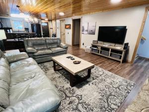a living room with a couch and a table at Dolly's # 1 condo in Sevierville