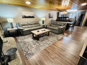 a living room with two couches and a table at Dolly's # 1 condo in Sevierville