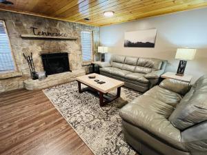 a living room with a couch and a fireplace at Dolly's # 1 condo in Sevierville