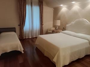 Postel nebo postele na pokoji v ubytování Villa Vescovado appartamento in casa vacanza