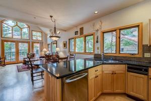 a kitchen with a large island in the middle of a room at Aspen Ridge 32 - 2 bedroom townhouse in Telluride