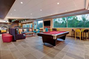 a billiard room with a pool table and chairs at Tru By Hilton Northlake Fort Worth, Tx in Northlake