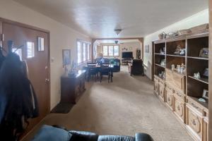 a living room with a table and a dining room at Riverfront Paradise - Entire Home in Gypsum