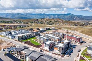 an aerial view of a building complex with mountains in the background at Purple Flower in Park City