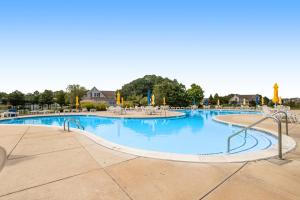 a large swimming pool with blue water at Bethany Bay - 37434 Pettinaro Dr #4805 in Ocean View
