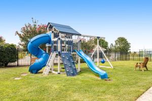 a playground with a blue slide in a park at Bethany Bay - 37434 Pettinaro Dr #4805 in Ocean View