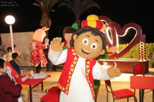 a person dressed as a monkey holding a sign at Chalet at Lasirena Mini Egypt Resort Ein Elsokhna Families Only in Ain Sokhna +117 photos