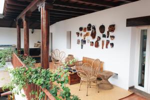 a patio with chairs and a table and some plants at Casa Del Calvario, 3BR Villa in Antigua Guatemala in Antigua Guatemala +37 photos