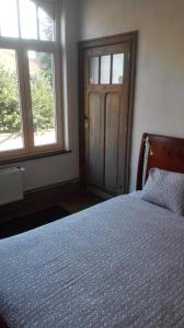 Postel nebo postele na pokoji v ubytování Guesthouse Oude Houtmarkt