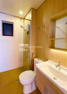 a bathroom with a toilet and a sink and a shower at Youth City 2 Bedroom Pool View by DKAY in Nilai in Nilai