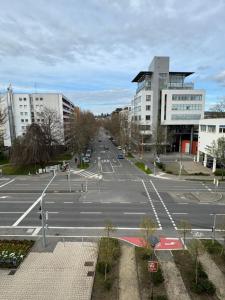 an empty parking lot in a city with buildings at Ariston Hotel in Sindelfingen