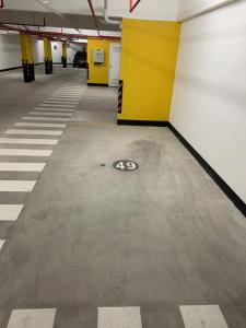 an empty parking garage with a number on the floor at 2BR in Center of Miraflores La Paz in Lima
