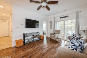 a living room with a couch and a ceiling fan at Comfy, Convenient Close to Rehoboth and Lewes! in Rehoboth Beach