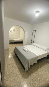 a bedroom with a large bed in a room at APARTAHOTEL ESTADIO GOLD in Medellín