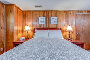 a bedroom with a large bed with two lamps at Beech Retreat in Inverness