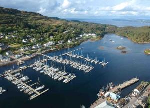 an aerial view of a marina with boats at Penlea ~ 1 bedroom Flat with Harbour view in Tarbert