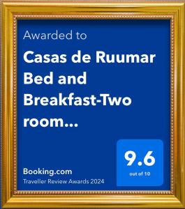 uma imagem emoldurada de um alojamento de acomodação e pequeno-almoço com dois quartos em Casas de Ruumar Bed and Breakfast-Two rooms for family available em Clarin