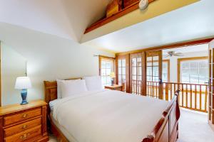 a bedroom with a bed and a balcony at The Stock Farm in Chestertown