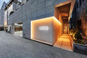 an entrance to a building with an intel sign on it at Hotel Intro in Busan