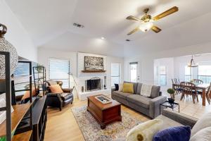 a living room with a couch and a fireplace at Nathan’s Haven in Azle