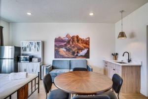 a kitchen and a living room with a table and a couch at Mountain View Studio in Heber City