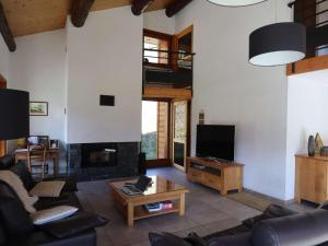 a living room with a couch and a fireplace at Chalet spacieux 3 étages, cheminée, garage, pour 6 pers, Arêches-Beaufort - FR-1-342-316 in Beaufort