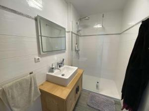 a white bathroom with a sink and a shower at Chalet spacieux 3 étages, cheminée, garage, pour 6 pers, Arêches-Beaufort - FR-1-342-316 in Beaufort +4 photos